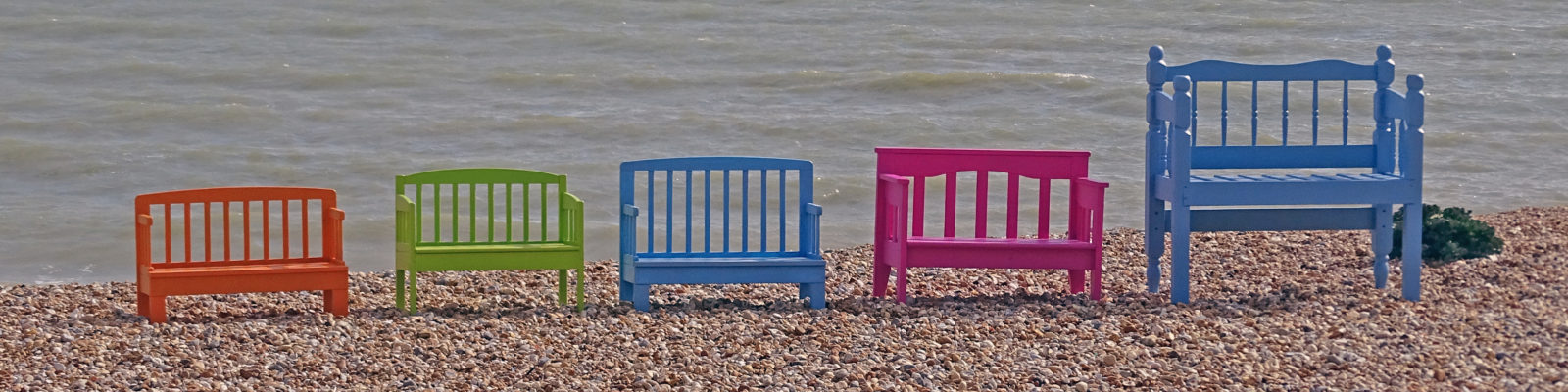 bright upcycled benches by the sea